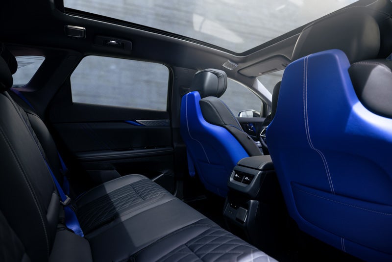 Back Seat View of the 2026 OPTIQ-V Blue Front Seats, Sun Roof, and Interior | Tom Naquin Cadillac in Elkhart IN